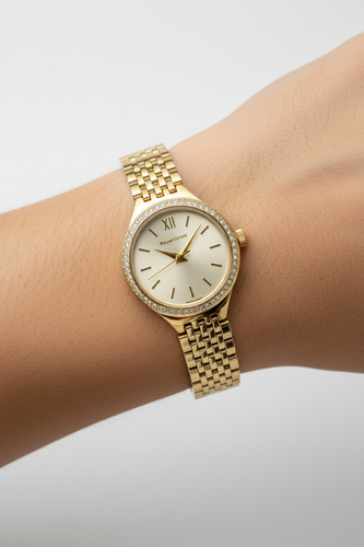 ساعت مچی زنانه رویال کروم با بدنه فلزی رنگ طلایی و قاب نگین دار