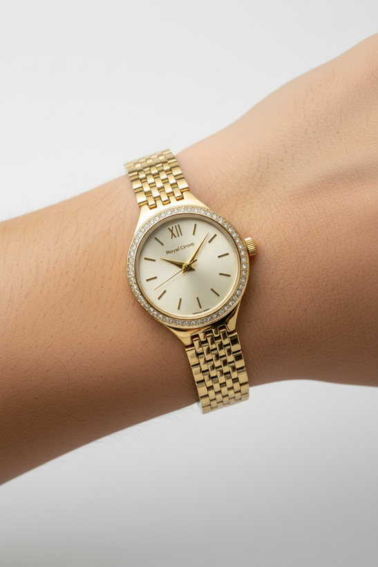 ساعت مچی زنانه رویال کروم با بدنه فلزی رنگ طلایی و قاب نگین دار