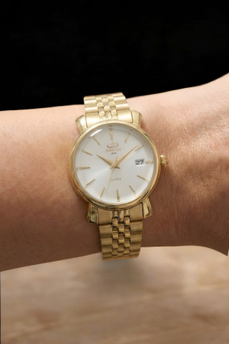 ساعت مچی زنانه فانتزی الگانس با بند فلزی طلایی و شیشه لبه دار