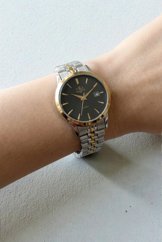 ساعت زنانه الگانس با بند فلزی دو رنگ استیل طلایی و صفحه مشکی